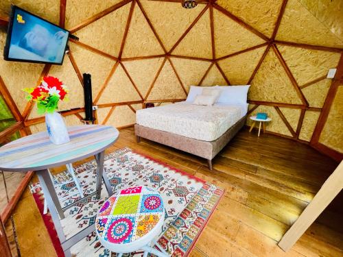 Postel nebo postele na pokoji v ubytování Glamping La Cabanita Santuario