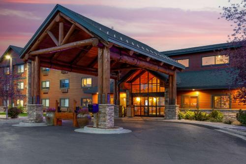 a building with a wooden pavilion in front of it at Best Western Plus McCall Lodge and Suites in McCall