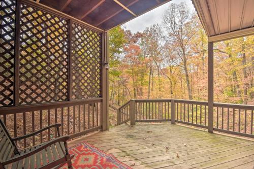 a screened in porch with two benches on a wooden deck at Big Canoe Cabin with Mountain View, Hiking and Lake! in Marblehill