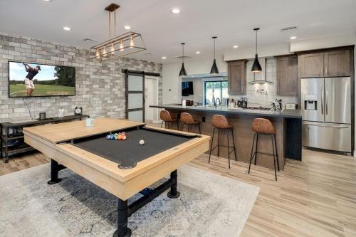 a kitchen with a ping pong table in a room at Private Pool & Spa ** Steps to Old Town ** Sanatized in Scottsdale