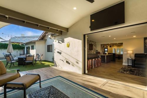 a living room with a large sliding glass door at Private Pool & Spa ** Steps to Old Town ** Sanatized in Scottsdale