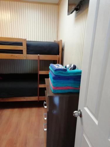 a room with a bunk bed at Cabañas Avenida España in Punta Arenas