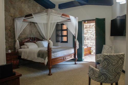 Postel nebo postele na pokoji v ubytování Hotel Canaria