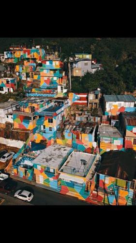 an aerial view of a city with colorful buildings at Summer all year! Oceanfront with Pool A/C in Aguadilla