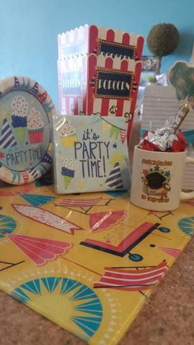 a table topped with lots of presents and books at Summer all year! Oceanfront with Pool A/C in Aguadilla