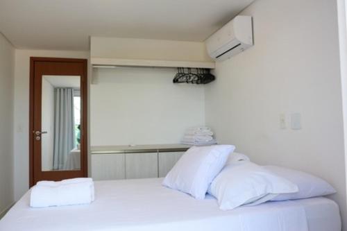 Ένα ή περισσότερα κρεβάτια σε δωμάτιο στο Residencial Makambira, Aconchegante e completo.