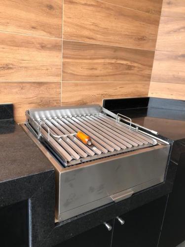 a grill sitting on top of a counter at Vistamar Duplex in Lima