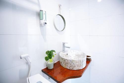 a bathroom with a sink and a mirror at Private room in Halong center-Almor Homestay in Ha Long