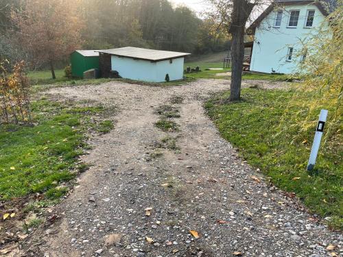 a dirt road in front of a house at Veselka in Dolní Bousov