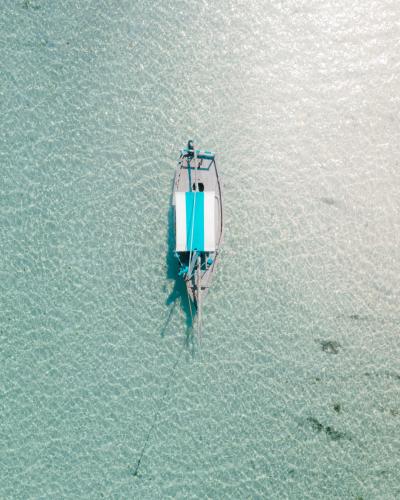 a boat in the water with a rope attached at Chole Mjini Treehouses Lodge in Utende