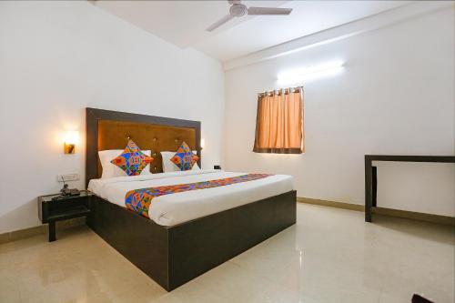 a bedroom with a large bed in a room at Via The Prasiddh in Agra