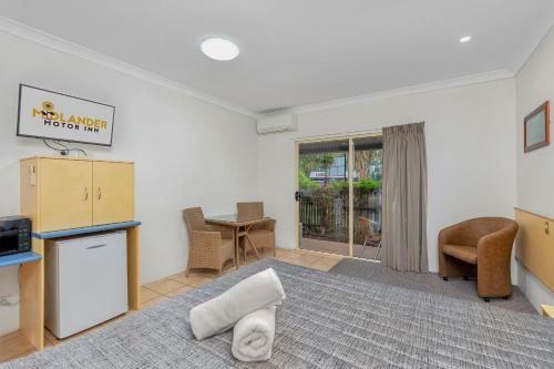 Un lugar para sentarse en Midlander Motor Inn