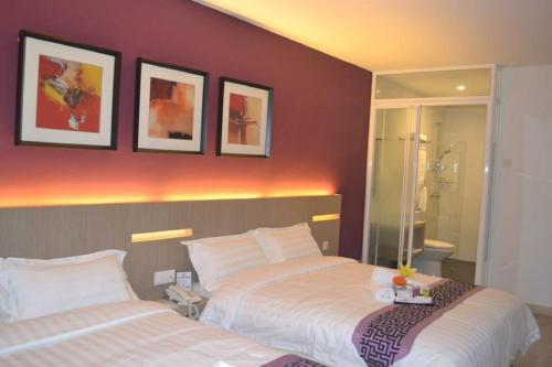 Letto o letti in una camera di Ashley Boutique Hotel