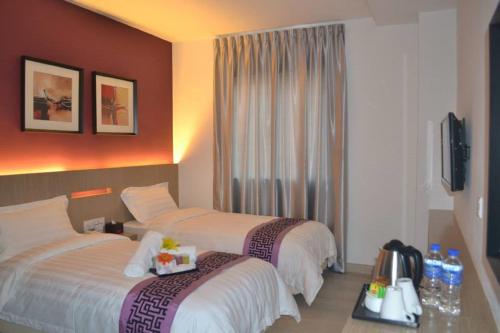 Letto o letti in una camera di Ashley Boutique Hotel