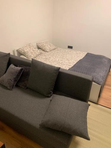 a bedroom with two beds with pillows on the floor at New Ozas flat in Vilnius