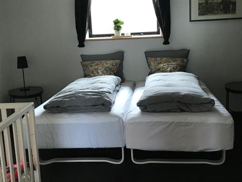 Katil atau katil-katil dalam bilik di Tiklo Bed and Breakfast