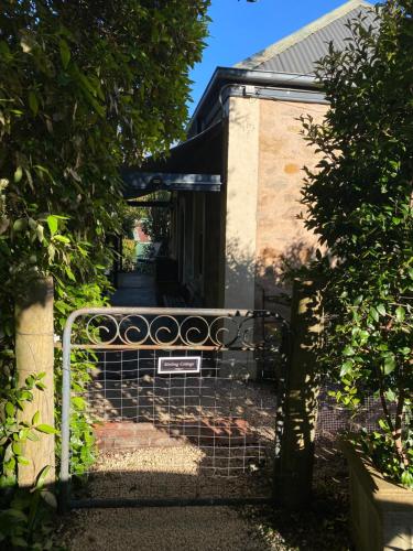 an entrance to a house with a gate at Stirling Cottage in Stirling