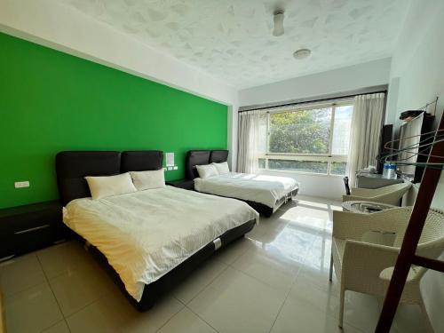 Una cama o camas en una habitación de Mang Yi Zhan Inn