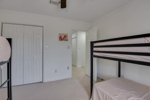 a bedroom with a bunk bed and a closet at Beautiful 3BR Townhouse Close to Downtown Augusta in Augusta