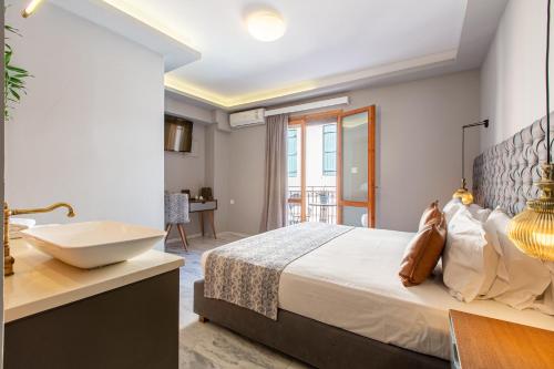 Cama o camas de una habitación en Minaret Suites and Apartments