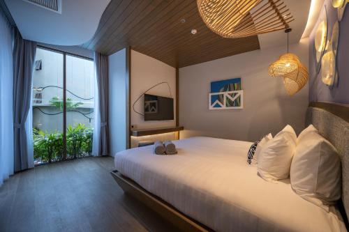Postel nebo postele na pokoji v ubytování Metadee Concept Hotel