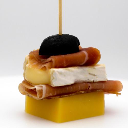 a hot dog on top of a yellow container at Guggital Hotel Restaurant in Zug