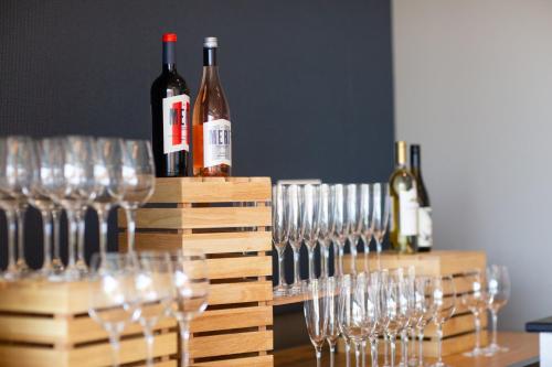 a bunch of wine glasses are lined up on a table at Hotel Indigo Seattle Everett Waterfront Place by IHG in Everett