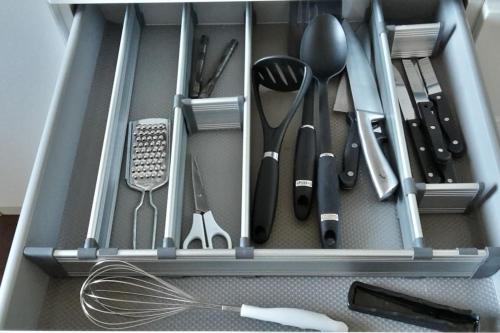 a drawer filled with kitchen utensils and a whisk at 2 Bedroom, free parking & Netflix near hospitals in Aberdeen