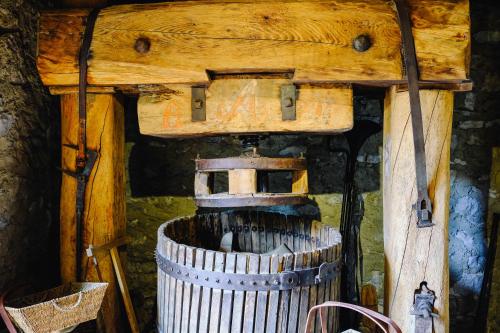 an old wooden wine barrel in a wooden house at AGRITURISMO CA' FENILE in Alzano Lombardo