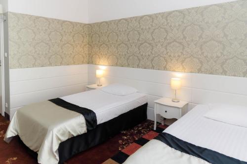 Cama o camas de una habitación en Hotel Lamberton