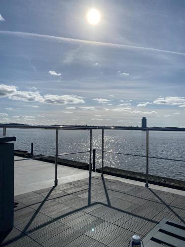 a view of the ocean from a pier at Ostsee Hausboot Schleswig Ostseeblick 1 in Schleswig