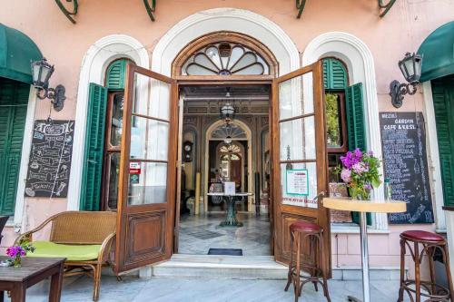 an entrance to a building with a large wooden door at Büyükada Anastasia Meziki History Mansion in Buyukada