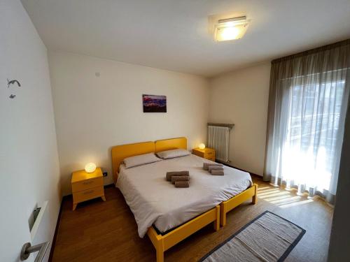 Postel nebo postele na pokoji v ubytování Appartamento Cornon