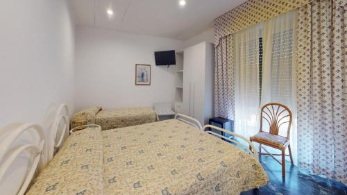 Postel nebo postele na pokoji v ubytování Hotel Zunino