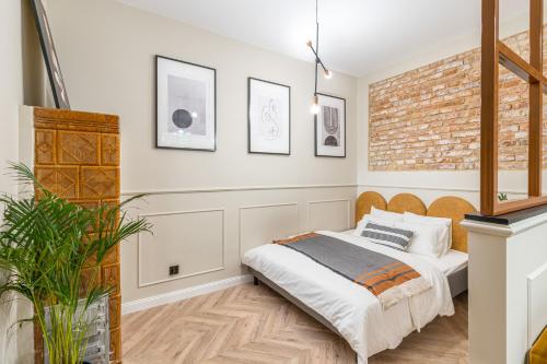 Ένα ή περισσότερα κρεβάτια σε δωμάτιο στο HOUSEHOST Apartment : Topolowa 26/17