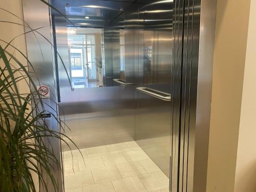 a glass door of a shower in a room at Hotel Michael in Gerasdorf bei Wien