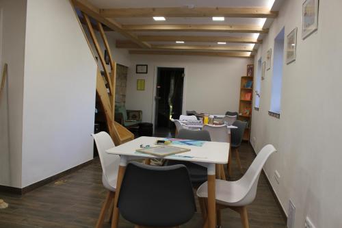 a dining room with a table and chairs at Odal Hawaii sro ubytování vzdělávání in Pěnčín