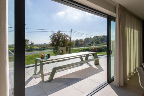 a bench on the balcony of a house at Yzerdyck in Diksmuide