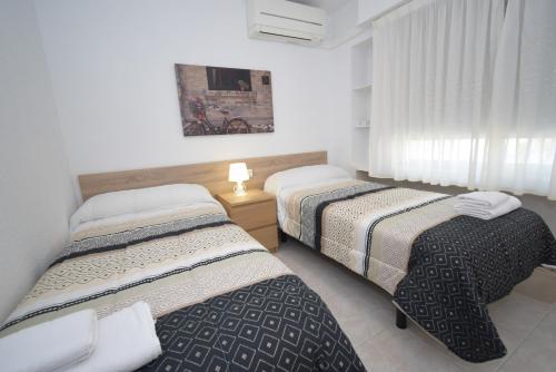 Postel nebo postele na pokoji v ubytování TOR MARAYA - Fincas Arena