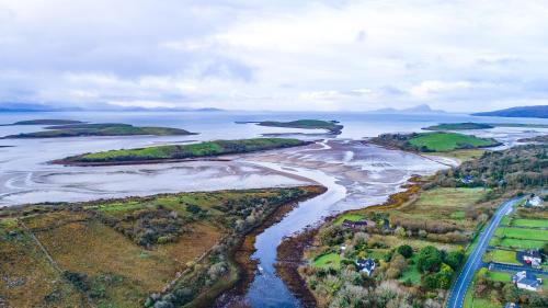 an aerial view of a river with forests and islands at Nevins Newfield Inn Ltd in Mulranny