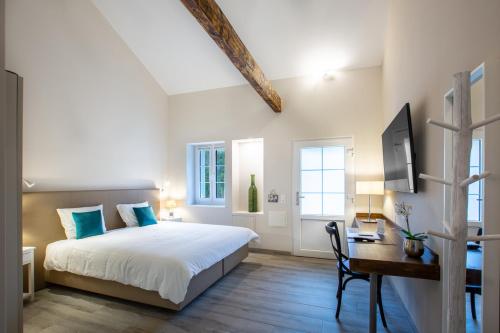 Postel nebo postele na pokoji v ubytování Auberge des Grands Bois