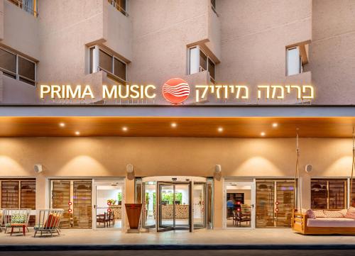 a building with a sign that reads primina music at Prima Music Hotel in Eilat
