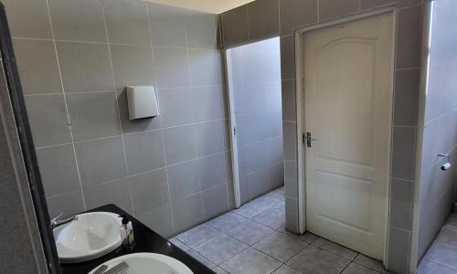 a bathroom with a toilet and a sink at SHALIMAR GARDENS HOTEL in Cape Town