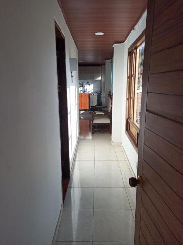 an empty hallway with a door and a room at Eliseo Tota Balcón in Tota