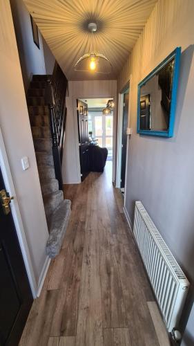 a hallway of a house with a staircase and a ceiling at The Farrier's by Spires Accommodation A convenient place to stay for exploring Cannock Chase in Hednesford