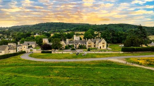 a village with houses and a winding road at Ellenborough Park in Cheltenham