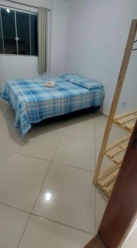 Postel nebo postele na pokoji v ubytování Aconchego Familiar Veredas