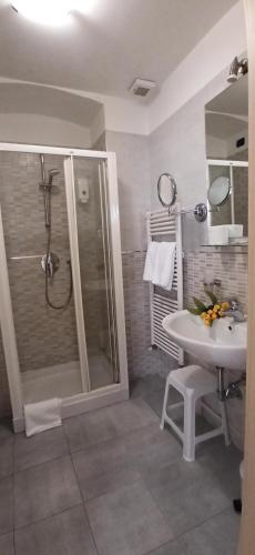 a bathroom with a shower and a sink at Camere Chicca in Sanremo