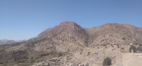 a group of mountains with a blue sky in the background at KASBAH Atlas-Aberdouz in Aït Hattab