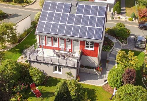 an aerial view of a house with solar panels on the roof at Landhaus Anneliese in Oberkotzau